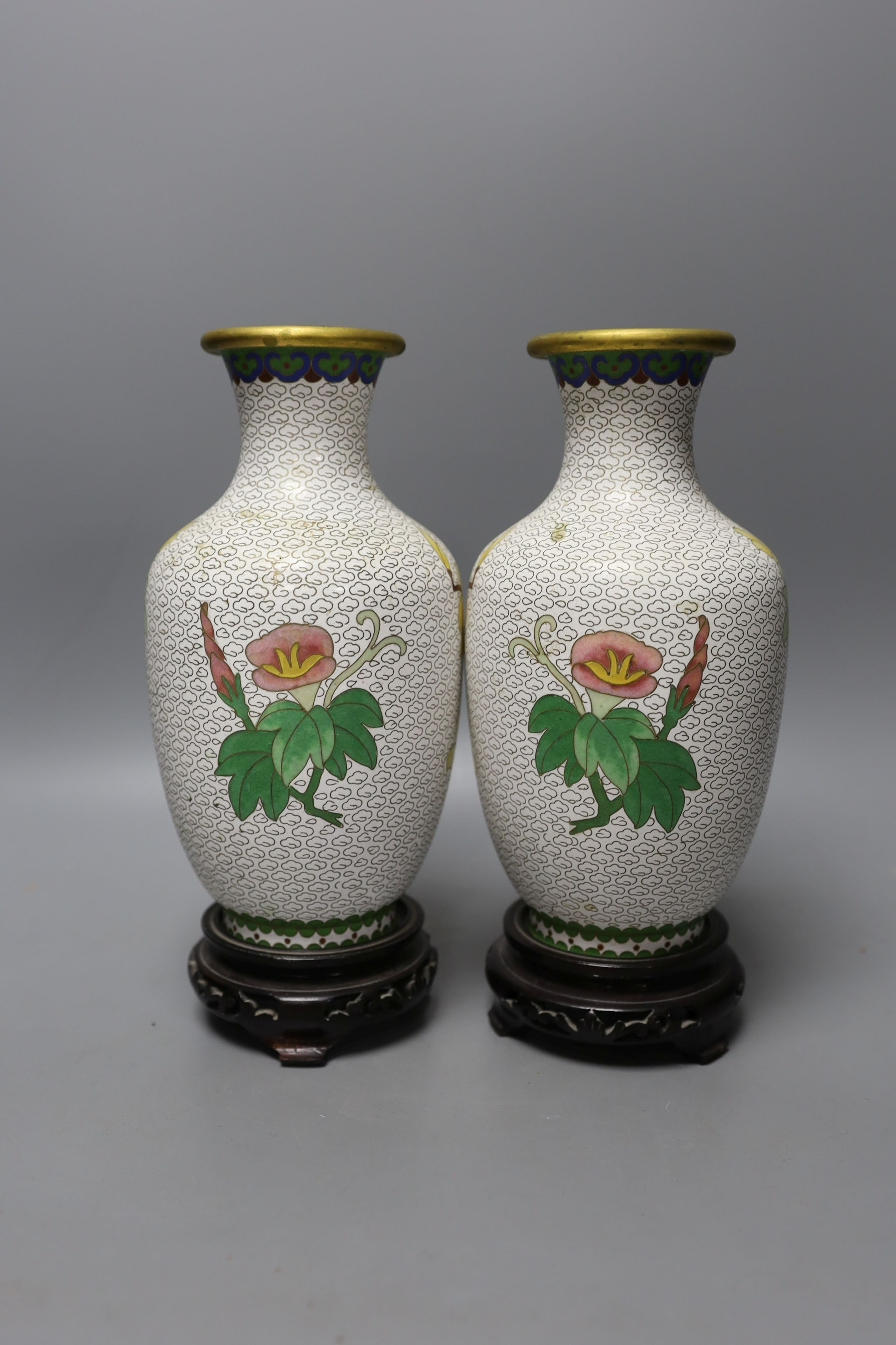 A pair of Chinese cloisonné enamel vases, 25cm tall including stands, together with a Chinese cloisonné enamel dragon bowl (3)